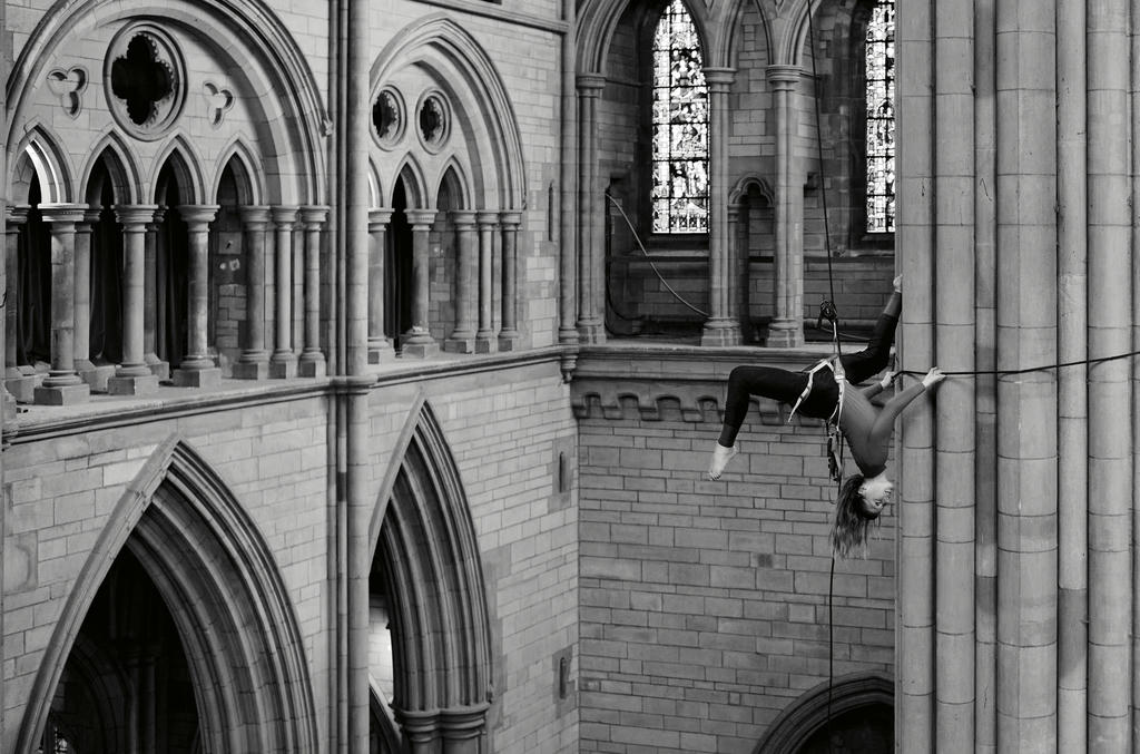 Georgie Barnett from Yskynna Vertical Dance Company warming up at rehearsal in Truro Cathedral