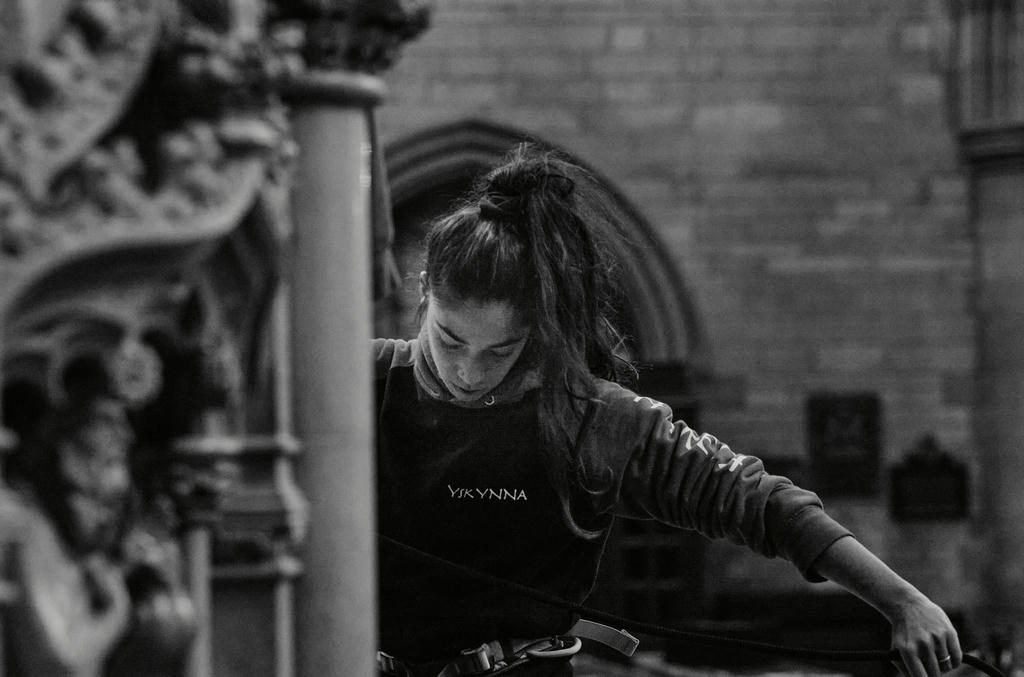 Ishita Raina from Yskynna Vertical Dance Company coiling rope after rehearsal in Truro Cathedral