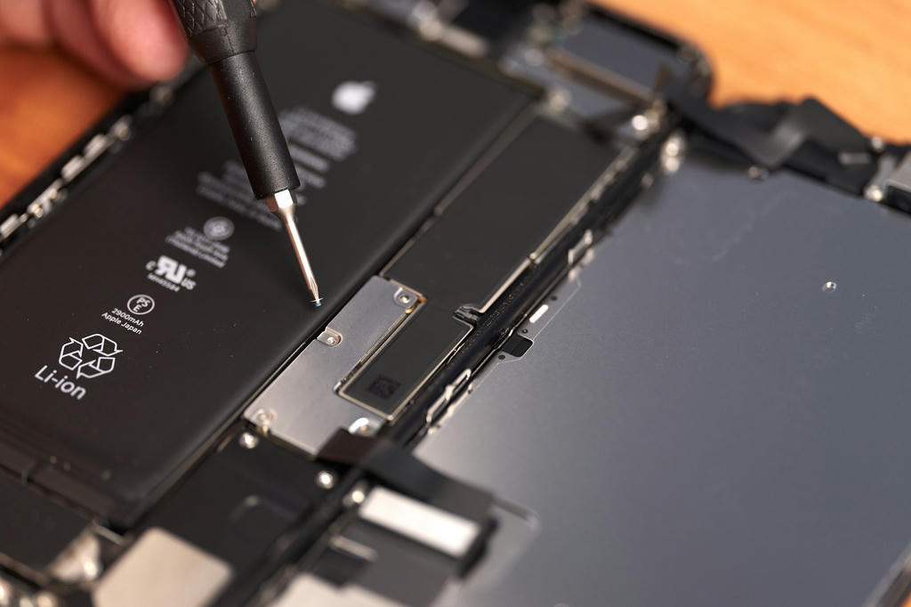 Removing the screen connector shield inside an iPhone 7 Plus